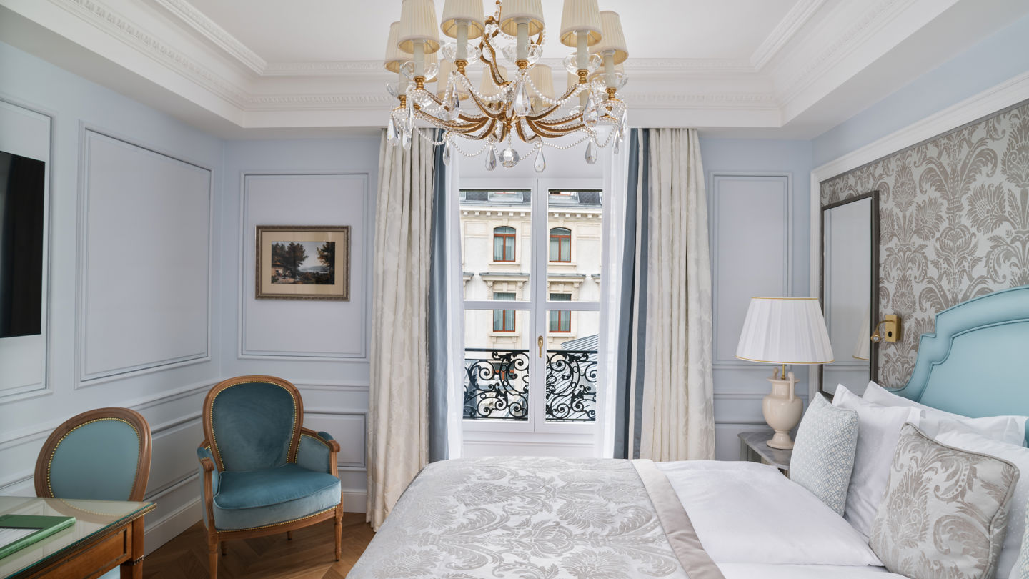 Bedroom of the Deluxe City and Garden View Room at Beau-Rivage Palace in Lausanne