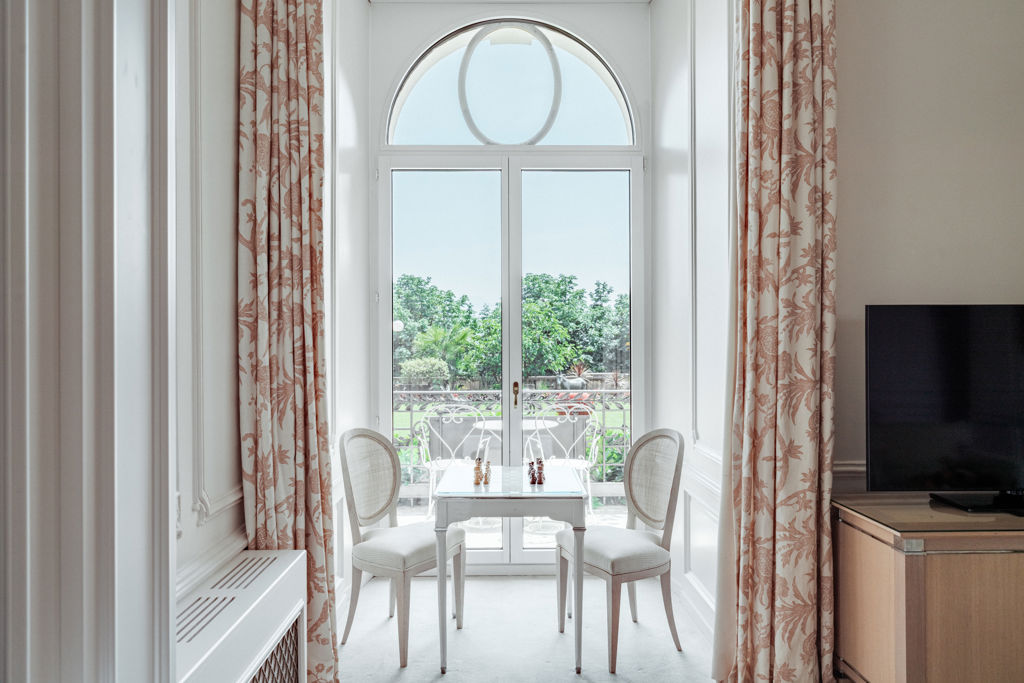 View of the gardens, the lake and the Alps from the Junior Suite Palace Ground Floor Room at Beau-Rivage Palace in Lausanne