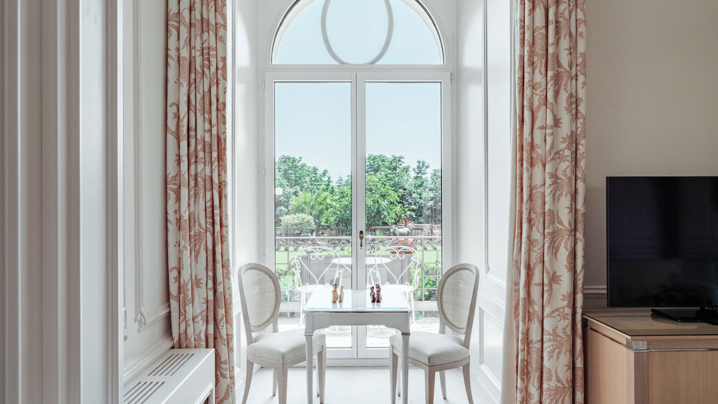 View of the gardens, the lake and the Alps from the Junior Suite Palace Ground Floor Room at Beau-Rivage Palace in Lausanne