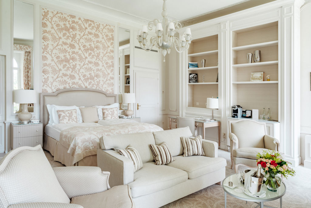 Bedroom and lounge area in the Junior Suite Palace Ground Floor Room at Beau-Rivage Palace in Lausanne