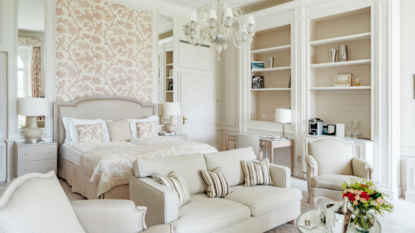 Bedroom and lounge area in the Junior Suite Palace Ground Floor Room at Beau-Rivage Palace in Lausanne
