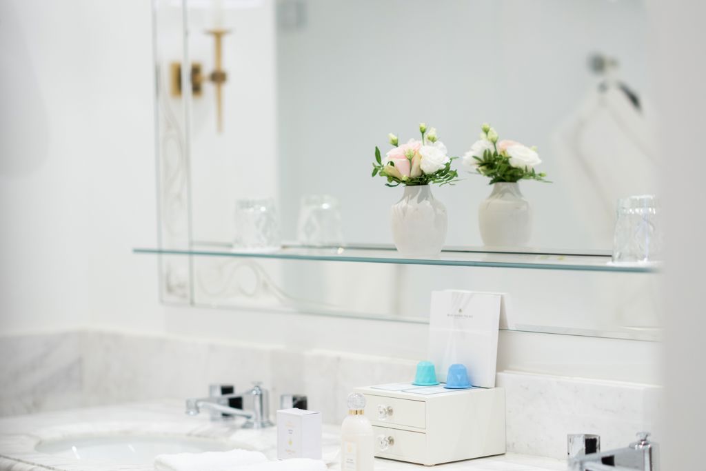 Guerlain amenities in the luxurious bathroom of the Art Déco Suite at Beau-Rivage Palace in Ouchy