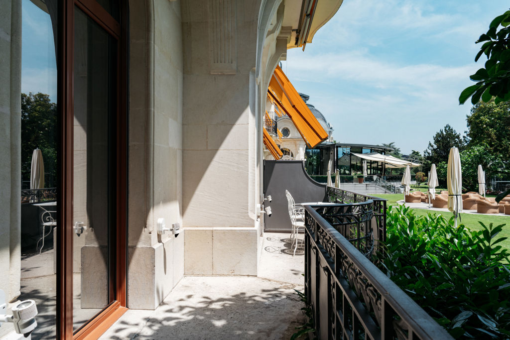 Terrace of the Junior Suite Palace Ground Floor Room at Beau-Rivage Palace in Lausanne overlooking the gardens, the lake and the Alps