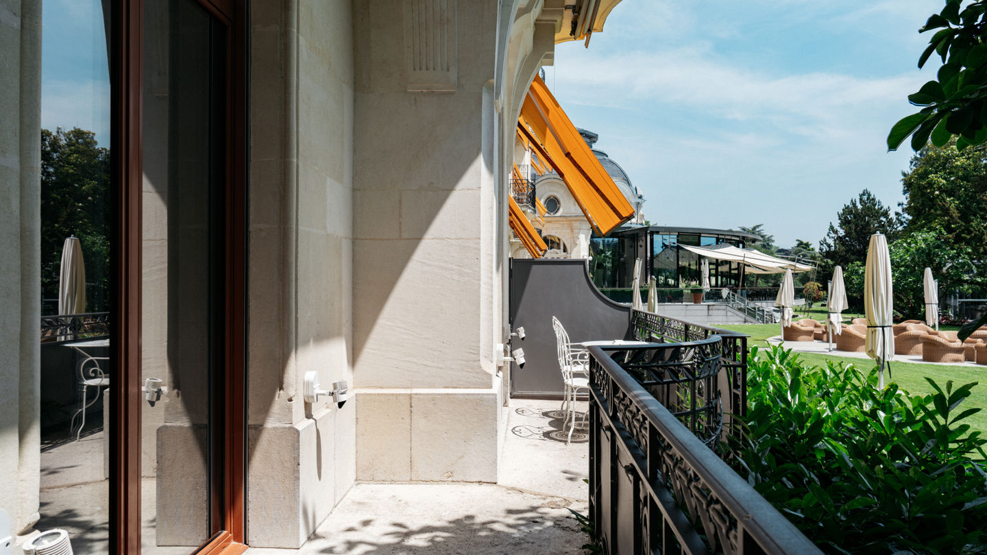 Terrace of the Junior Suite Palace Ground Floor Room at Beau-Rivage Palace in Lausanne overlooking the gardens, the lake and the Alps