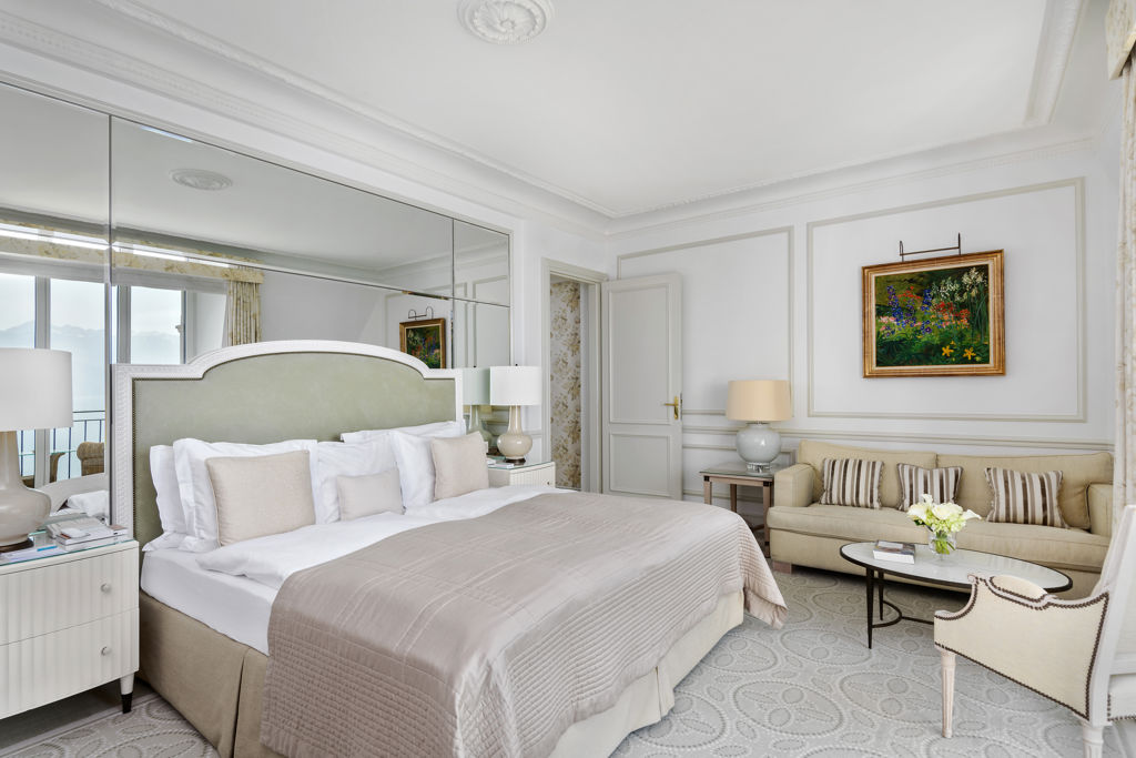 Bedroom in the Deluxe Lake and Alps View Room at Beau-Rivage Palace in Lausanne