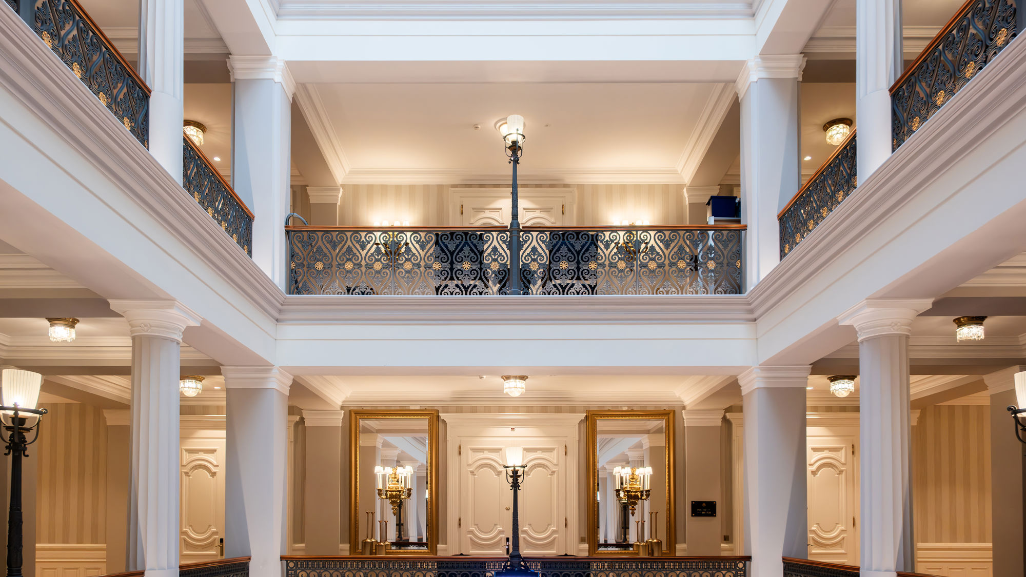 Majestic staircases and a succession of historic corridors at the Beau-Rivage Palace Lausanne—a luxury palace hotel in Lausanne-Ouchy, Switzerland—featuring Belle Époque interiors, heritage, architectural legacy, and a premium experience at a 5-star hotel on Lake Geneva. Send feedback Translation results available