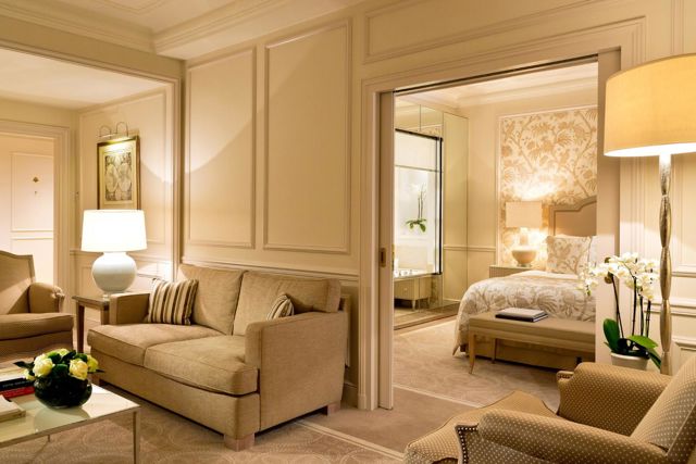 Bedroom and lounge area in the Junior Suite Léman Room at Beau-Rivage Palace in Lausanne
