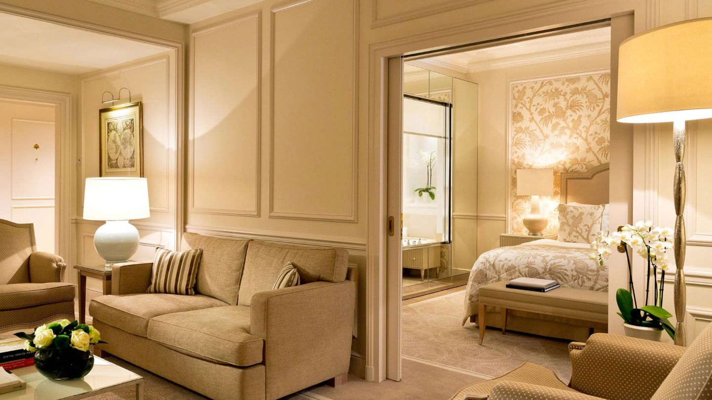 Bedroom and lounge area in the Junior Suite Léman Room at Beau-Rivage Palace in Lausanne
