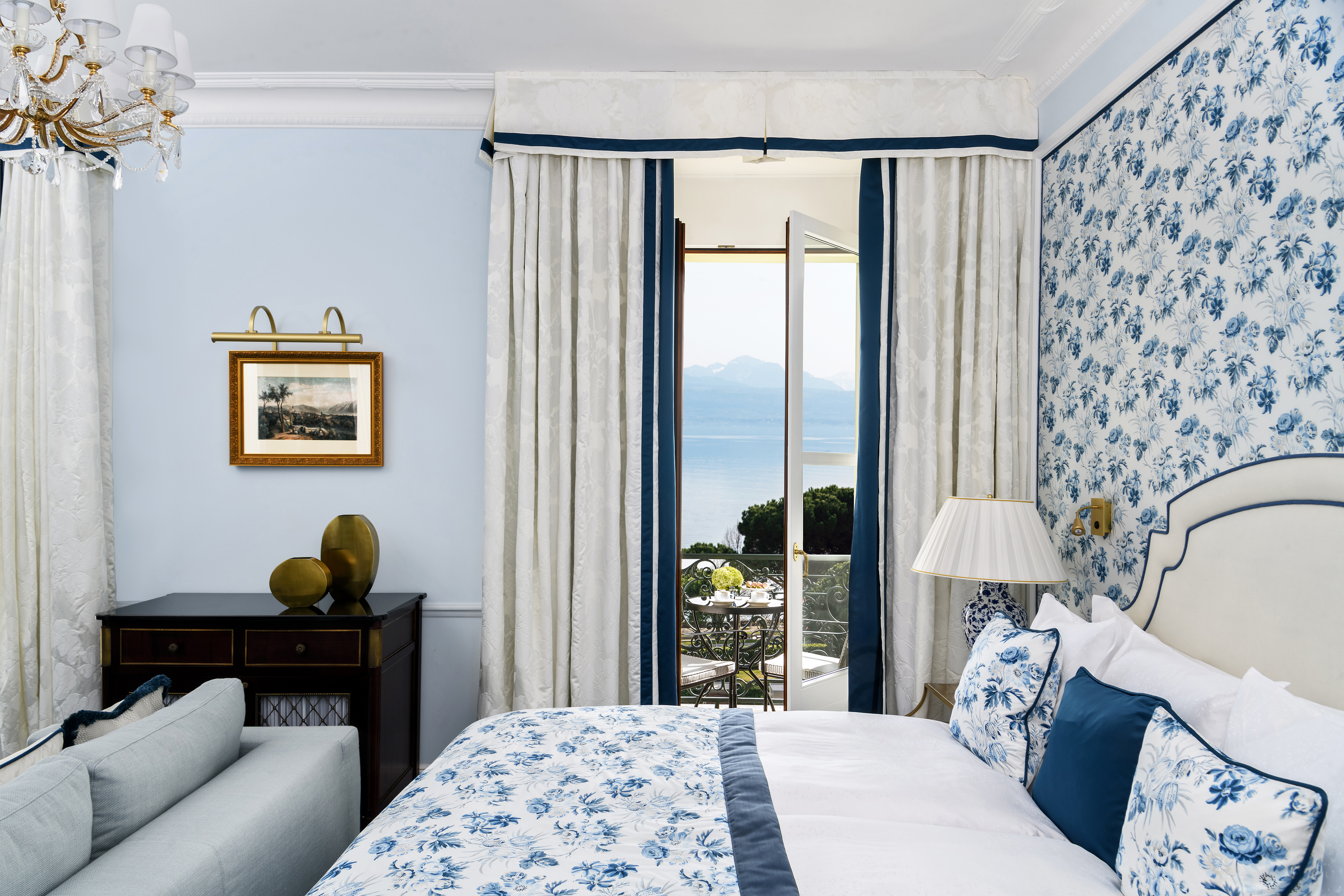 Details of the bedroom of the Deluxe Lake and Alps View Room at Beau-Rivage Palace in Lausanne overlooking the lake and the Alps