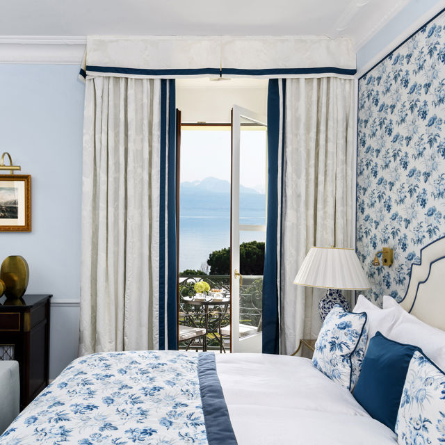 Details of the bedroom of the Deluxe Lake and Alps View Room at Beau-Rivage Palace in Lausanne overlooking the lake and the Alps