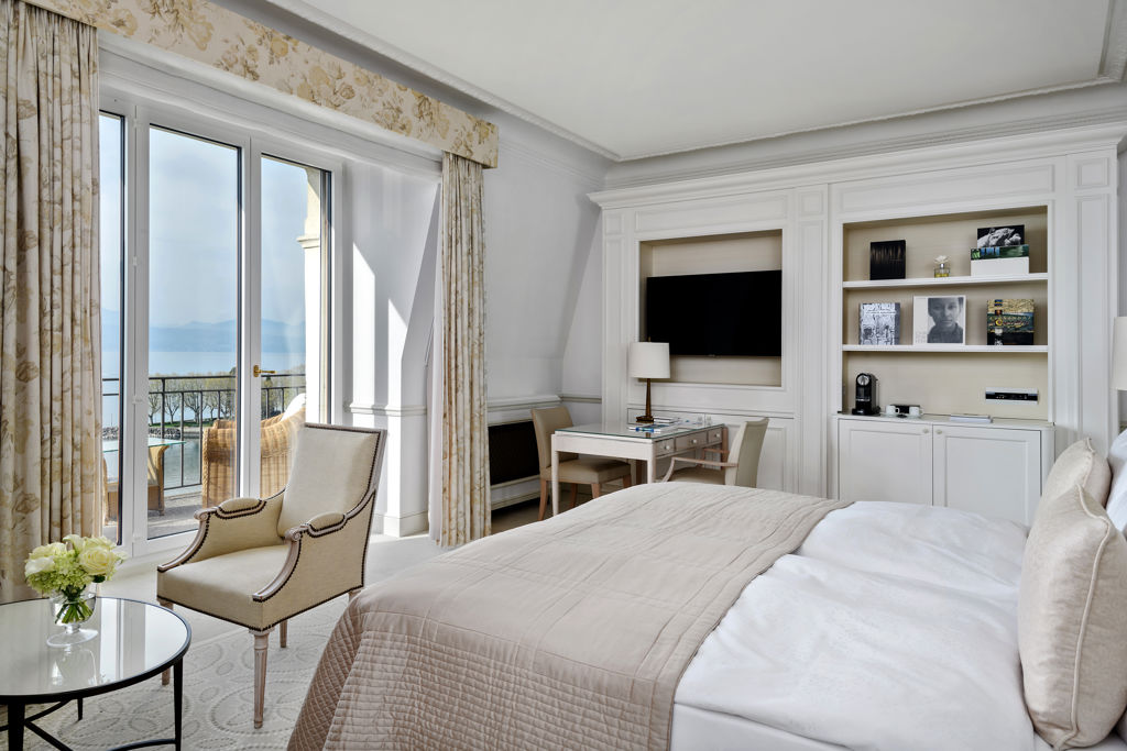 Bedroom in the Deluxe Lake and Alps View Room at Beau-Rivage Palace in Lausanne overlooking the lake and the Alps