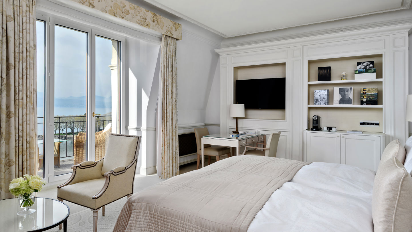 Bedroom in the Deluxe Lake and Alps View Room at Beau-Rivage Palace in Lausanne overlooking the lake and the Alps