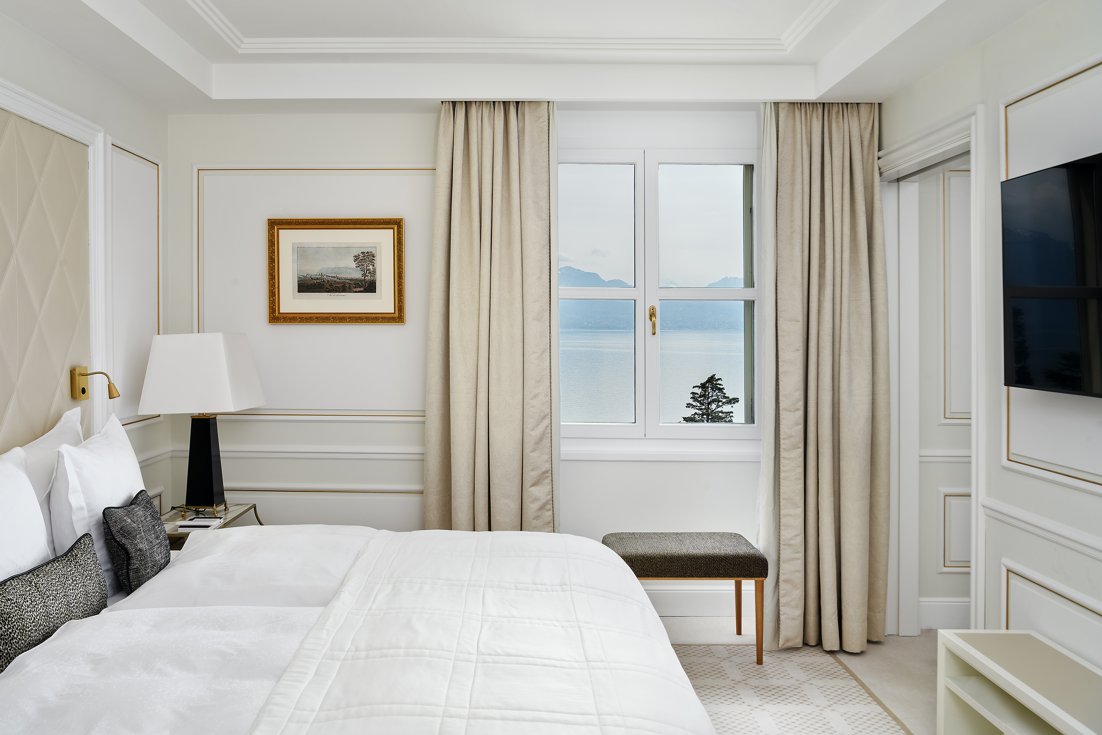 Bedroom of the Deluxe Riviera Room at Beau-Rivage Palace in Lausanne overlooking the lake and the Alps