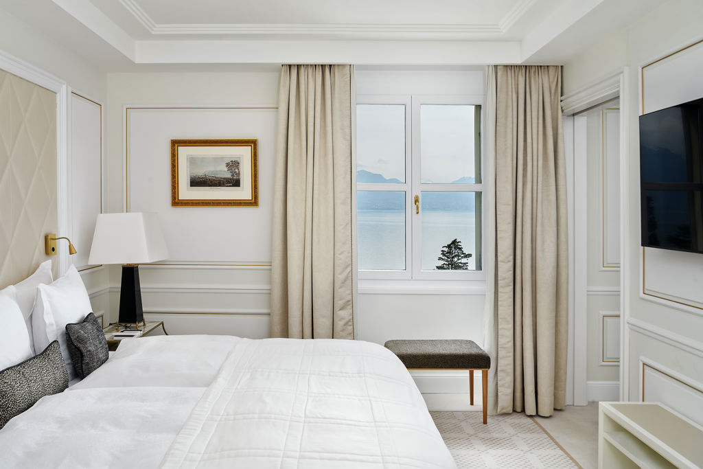 Bedroom of the Deluxe Riviera Room at Beau-Rivage Palace in Lausanne overlooking the lake and the Alps