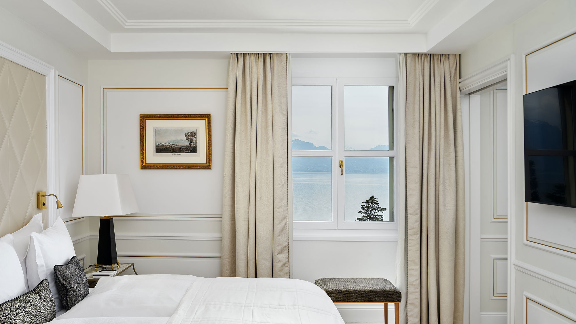 Bedroom of the Deluxe Riviera Room at Beau-Rivage Palace in Lausanne overlooking the lake and the Alps